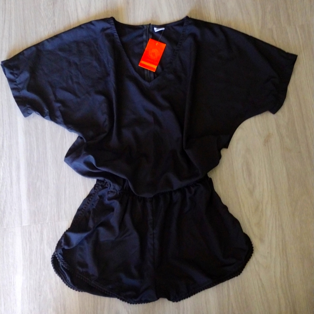 Black romper. New with tags M/L